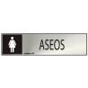 Cartel informativo "aseos" mujer (inox adhesivo 0.8mm) 5x20cm normaluz